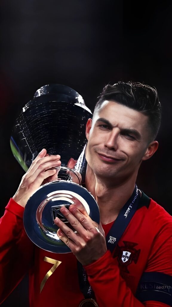Cristiano Ronaldo holding Nations League trophy with a cheeky expression – Portugal jersey – 4K HD wallpaper.