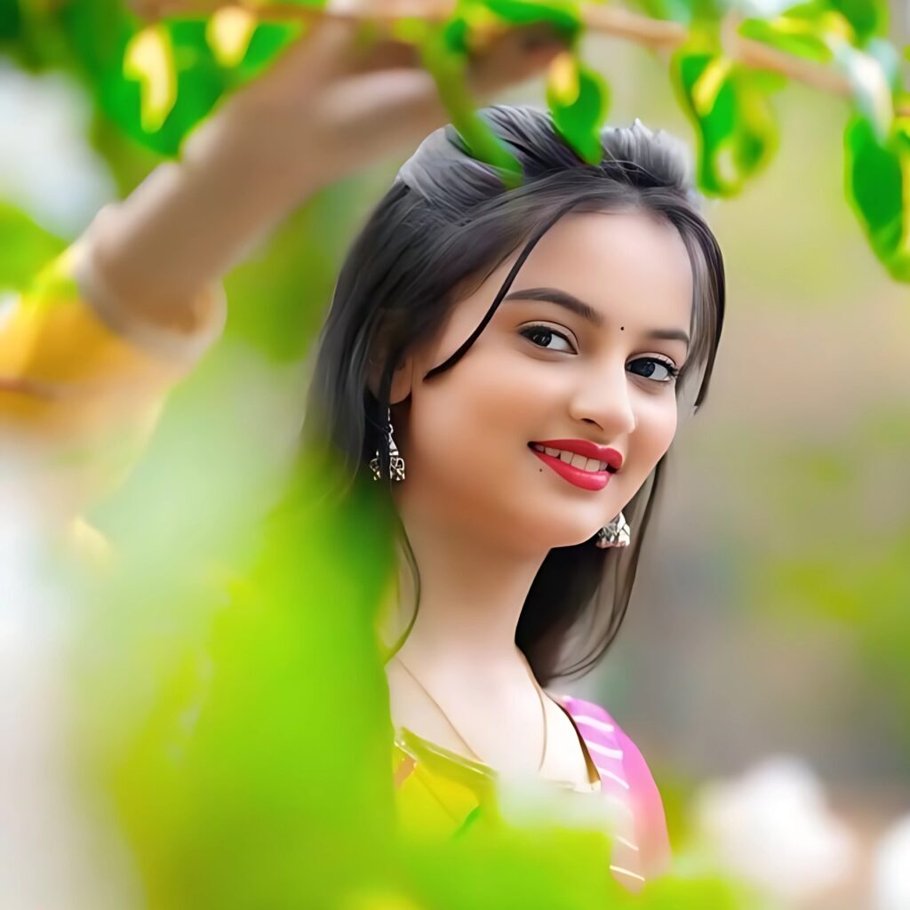 Cute girl profile picture in traditional outfit with natural background and fresh green leaves