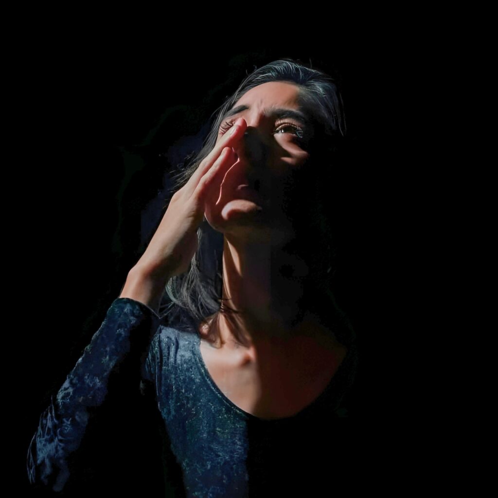 Moody girl in shadows with light on face – emotional black aesthetic DP for girls