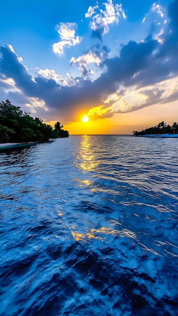 Breathtaking 64k ultra HD wallpaper of a tropical beach sunset with golden sunlight reflecting on deep blue ocean waters under a dramatic sky.