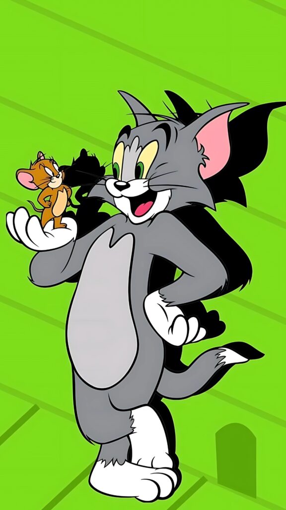 Full HD Tom and Jerry wallpaper showing the cheerful cartoon duo with Tom holding Jerry in his palm against a bright green background