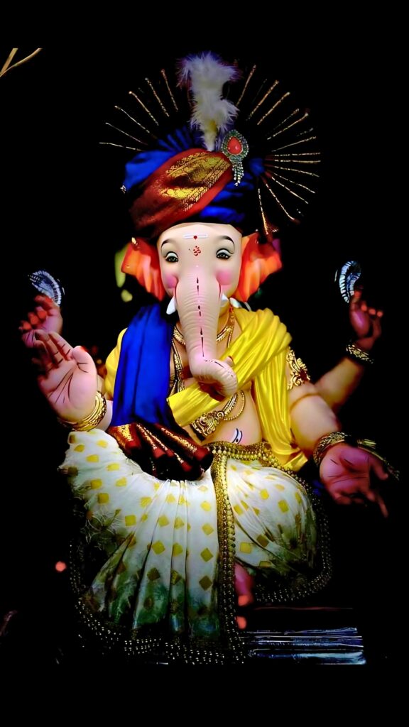 Lord Ganesha idol in traditional attire with vibrant colors, Ganpati Bappa Murti HD for festival and devotional wallpaper