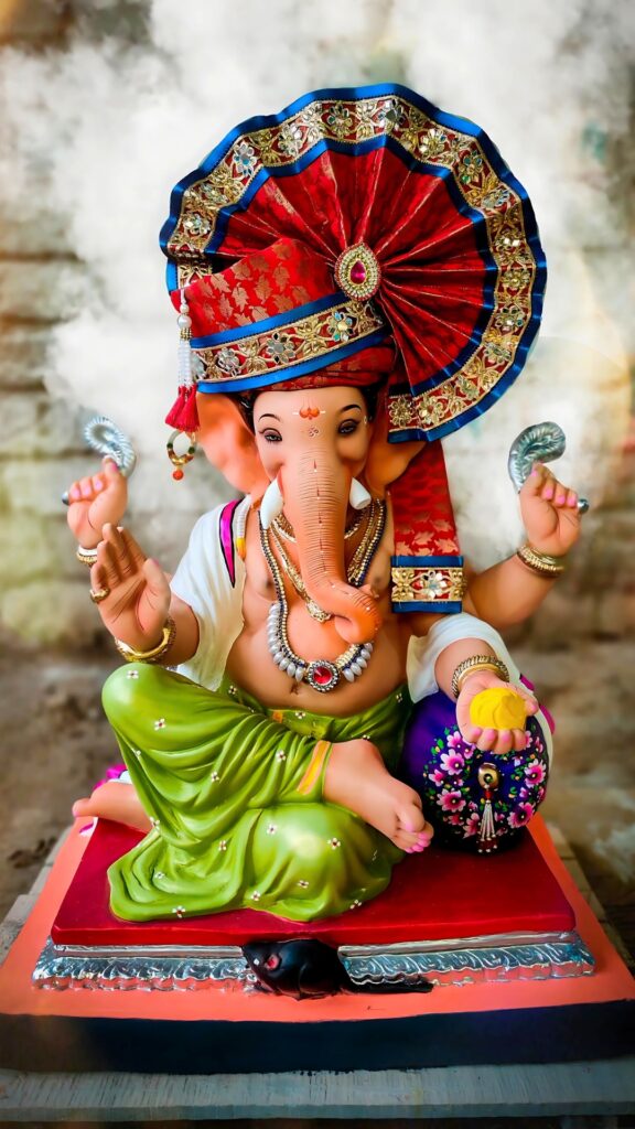 Colorful Ganpati Bappa idol in traditional attire with green dhoti and red turban – HD phone wallpaper