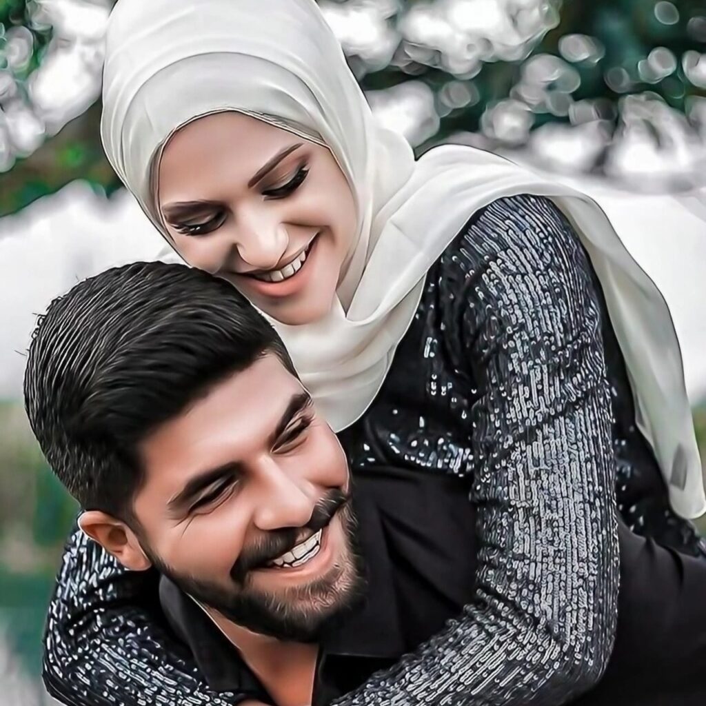 Happy Muslim couple in love, smiling as the wife lovingly hugs her husband from behind — perfect HD phone husband-wife couple DP for WhatsApp.