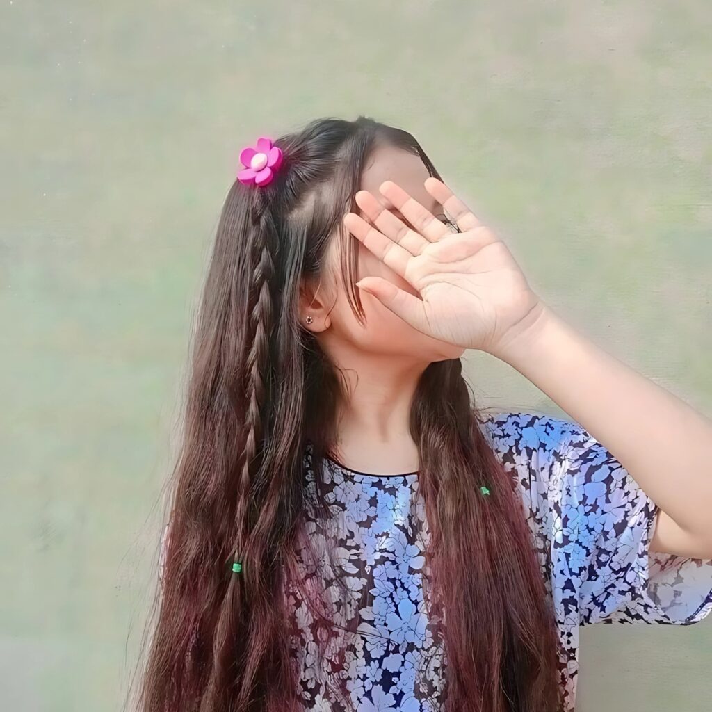 Hidden face girl aesthetic photo with long braided hair, floral clip, and printed top – soft Instagram vibe for girls
