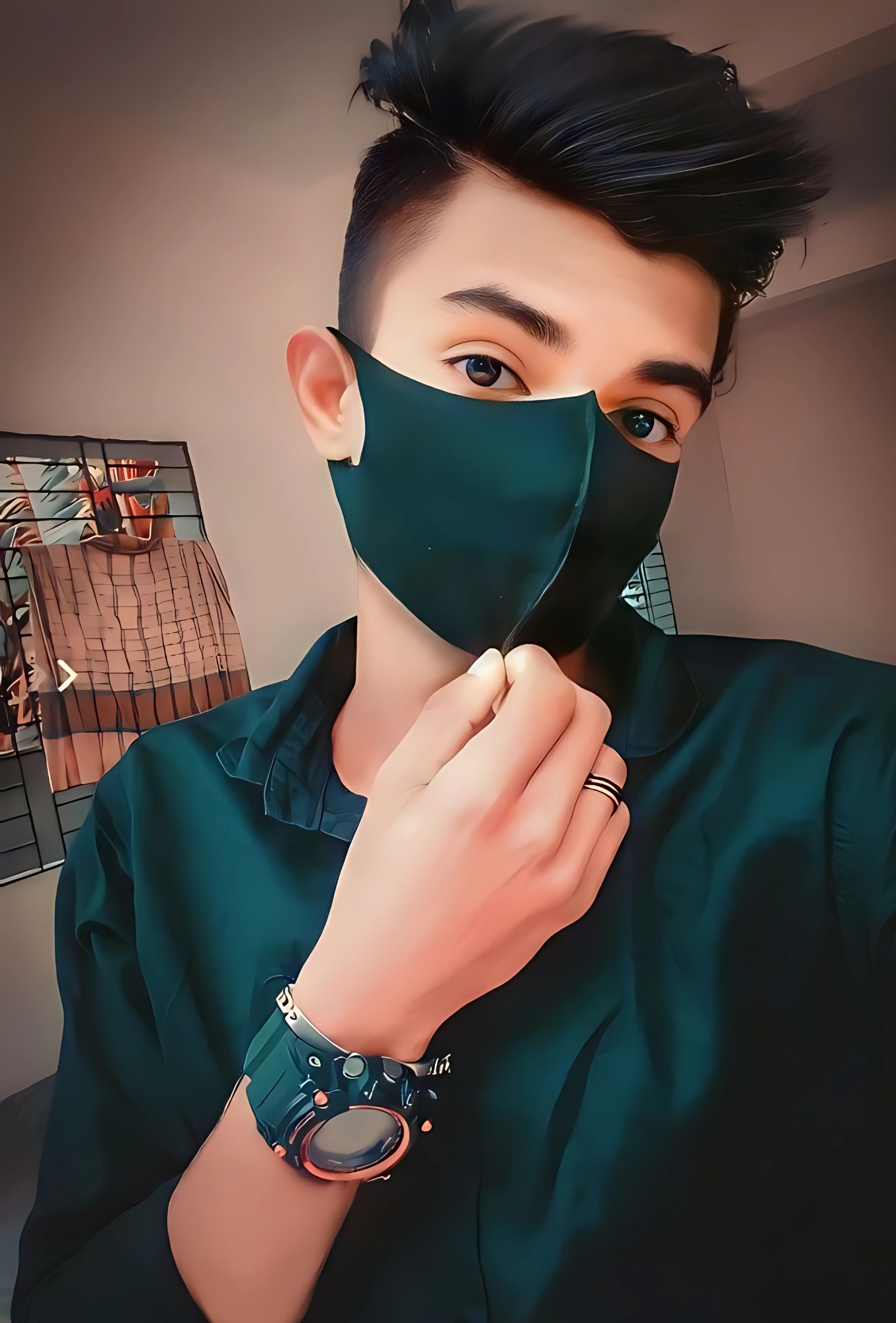 Stylish boy in dark shirt and black mask taking a selfie indoors – perfect Instagram DP