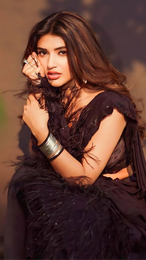Telugu actress Sheela in a hot black feathered dress – glamorous portrait in HD.