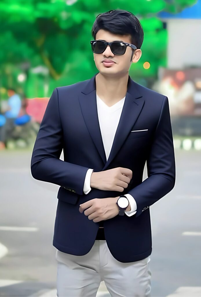 Stylish single boy in HD photo wearing a navy blazer, sunglasses, and watch, standing confidently outdoors.
