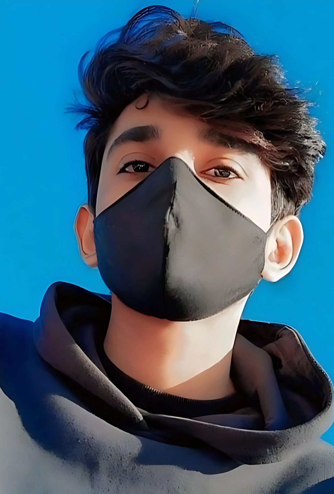 HD profile picture of a boy wearing a black face mask against a bright blue sky background