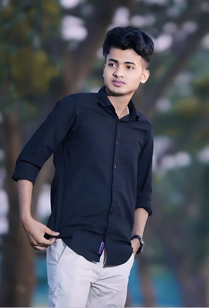 Young stylish boy wearing black shirt and white pants, posing confidently outdoors, perfect for single boy wallpapers and DPs.