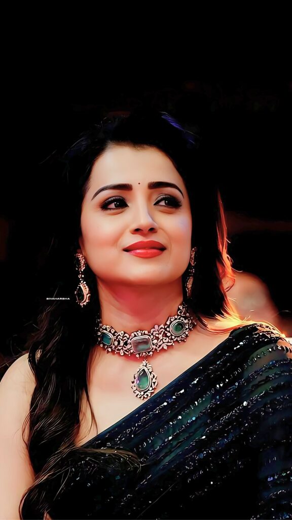 Telugu actress in black sequin saree and traditional emerald jewelry at an event – HD close-up photo