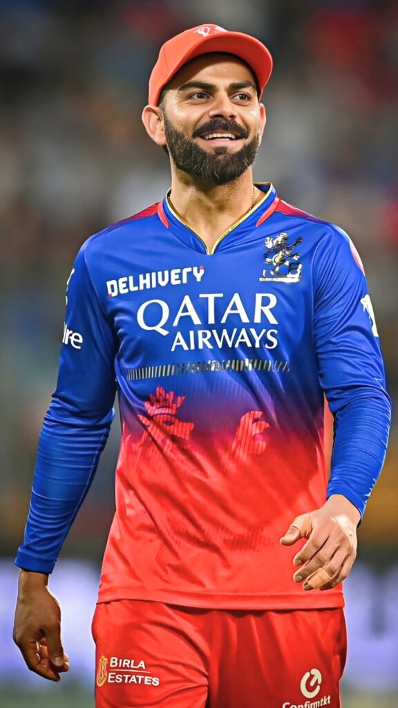 Virat Kohli in Royal Challengers Bangalore (RCB) jersey smiling during an IPL match – HD wallpaper.