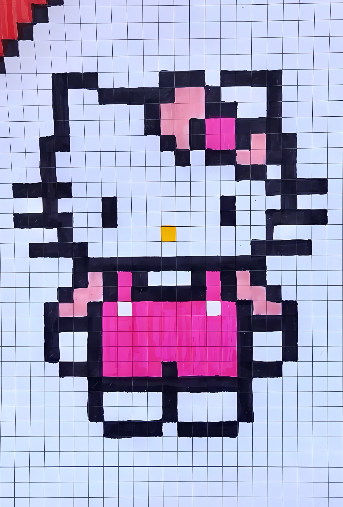 Dibujo pixelado de Hello Kitty con moño rosa y ropa fucsia sobre papel cuadriculado, ideal para colorear y decorar cuadernos.