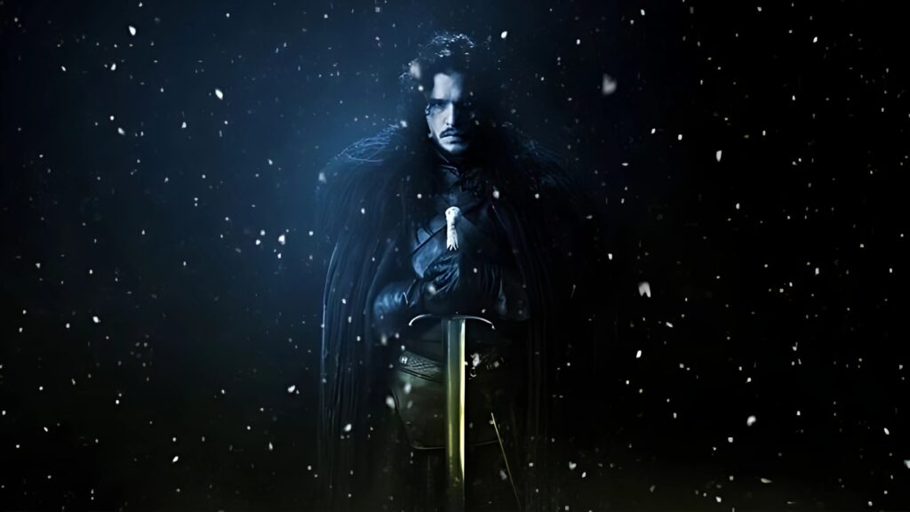 Jon Snow standing with sword in falling snow – Game of Thrones HD PC wallpaper