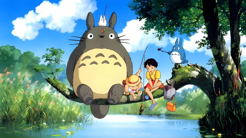 Studio Ghibli desktop wallpaper showing Totoro, Mei, Satsuki, and forest spirits sitting on a tree branch over a lake while fishing in a peaceful natural setting